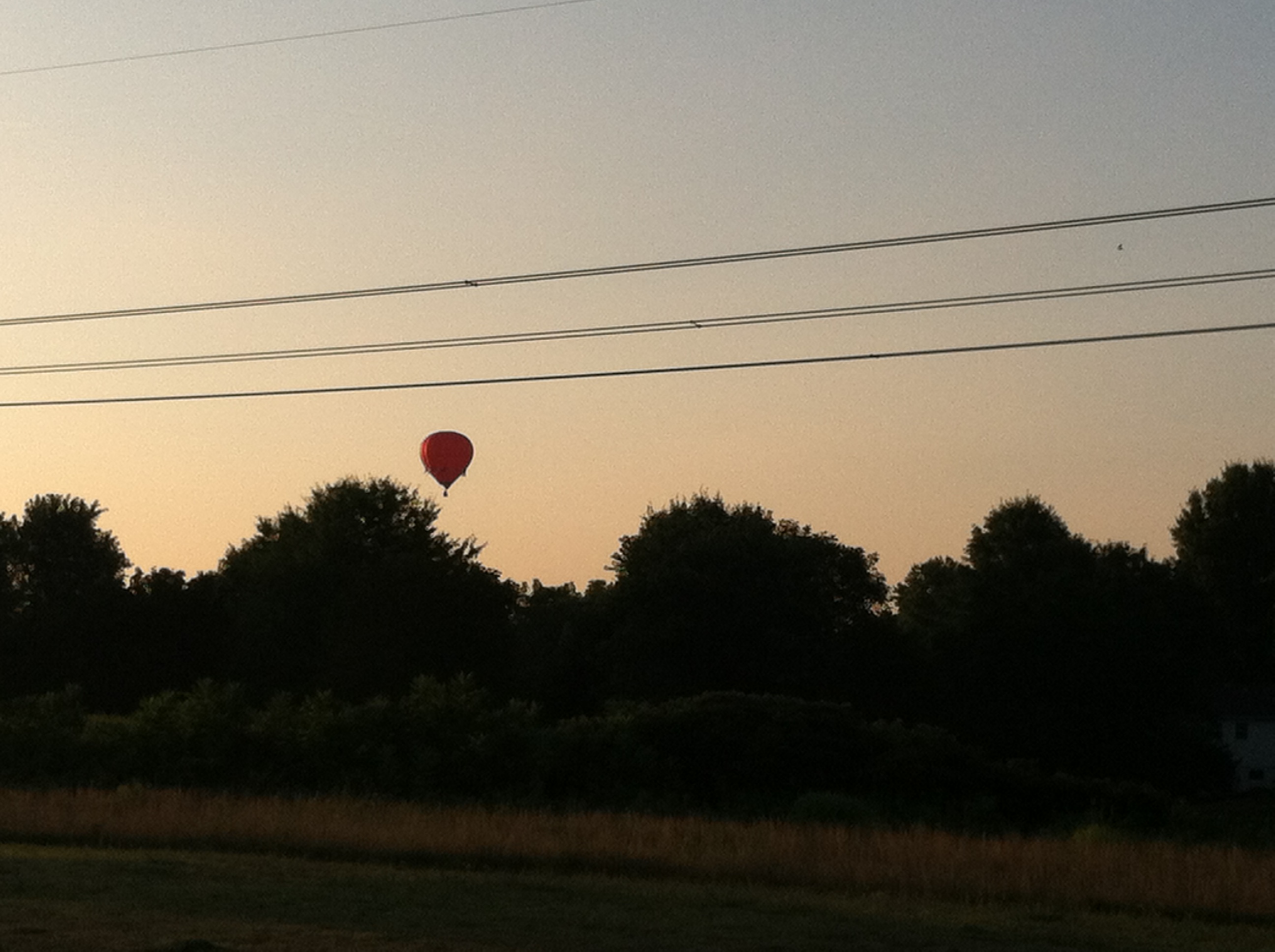 A Hot Air Balloon flying in the Great Valley.